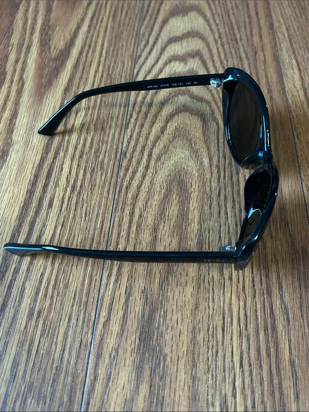 Prada SPR 16S 57-16 1AB-1A1 140 3N Cat-Eye Glossy Sunglasses -